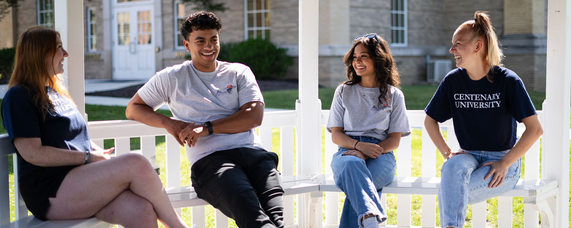 admissions Admissions counselors sitting outside in gazebo